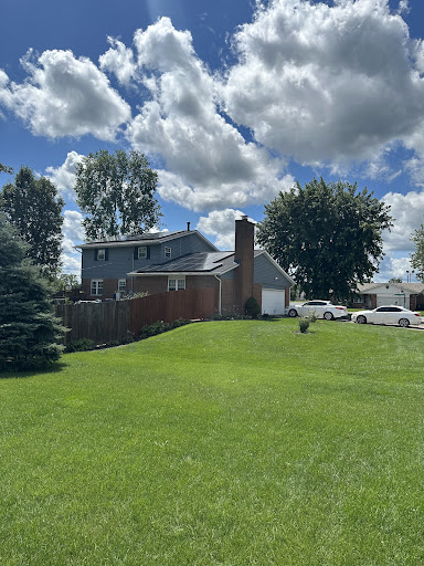Two-story home with rooftop solar, photo shared by the reviewer